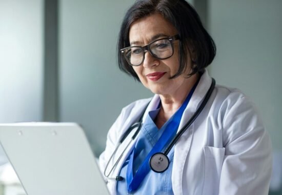 Female doctor looking at screen